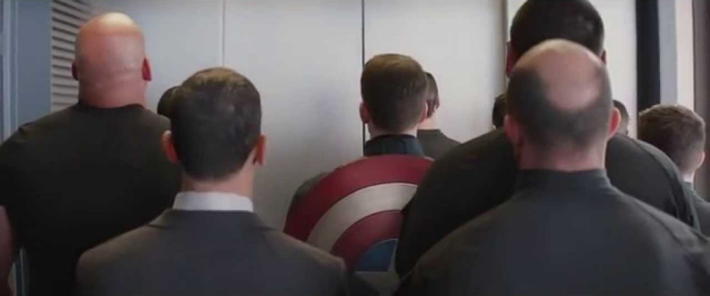 Back of heads in an elevator.  Precursor moment to an amazing fight scene in Captain America: The Winter Soldier